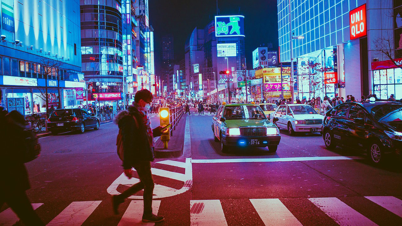 Man at pedestrian crossing in Tokyo street